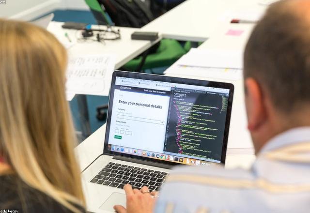 Developer writing React and Node.js code on a laptop